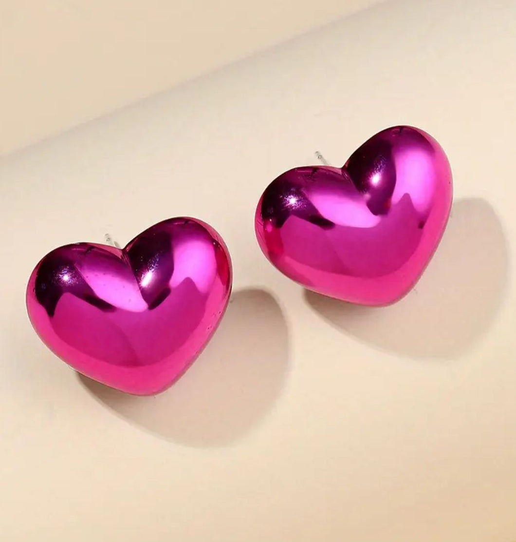 ARETES CORAZONES MEDIANOS FUCSIA